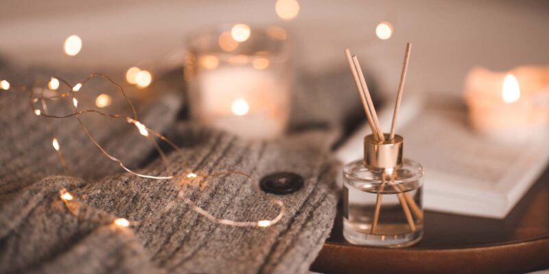 Scented candle, towel and oil diffuser